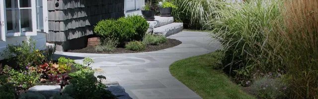 Bluestone walkway with natural stone wall