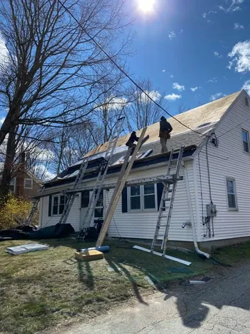 Workers on a roof.