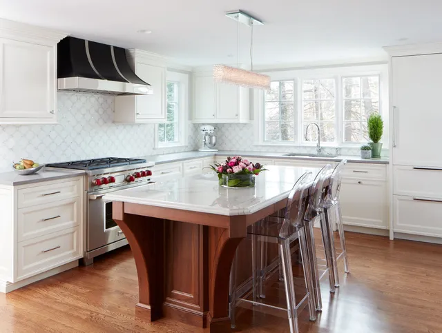 Kitchen with marble counters and tile backsplash