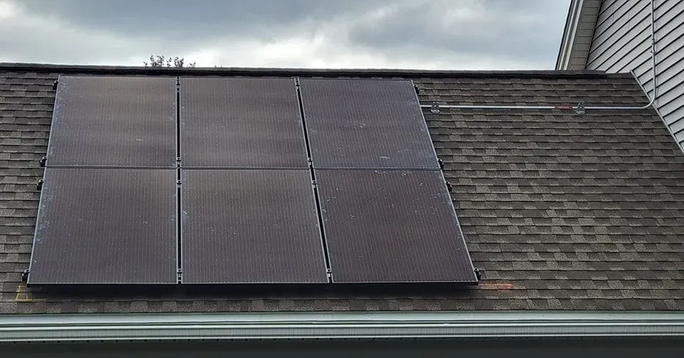 A roof with a lot of solar panels on it