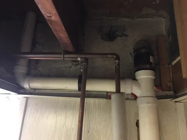 Copper and PVC pipe work in residential basement