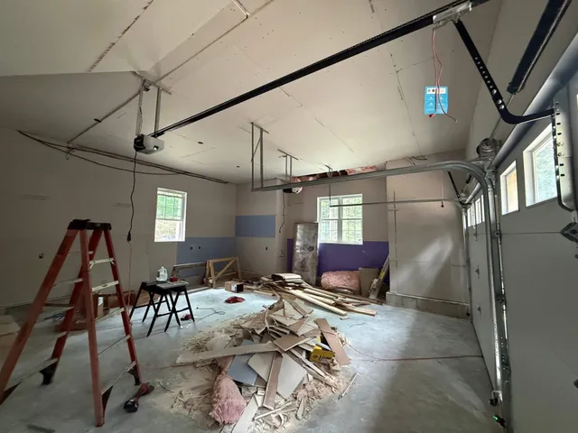 Garage interior during a door and opener installation project by Nolin Overhead Doors