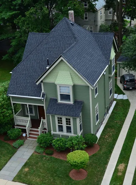 Dorchester exterior: new roof, siding and paint