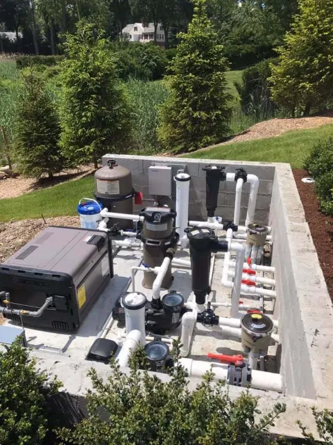 A swimming pool system is being built in a concrete bunker.