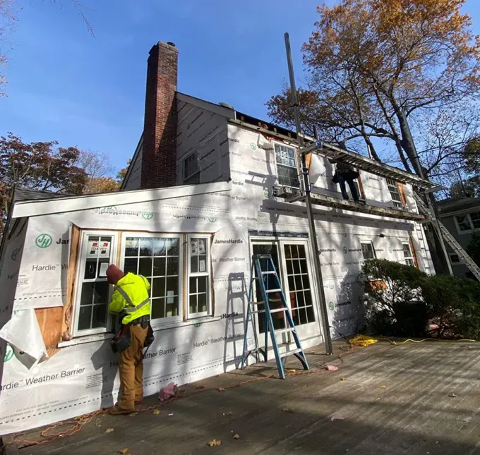 Natick Massachusetts home during siding deck and roof replacement