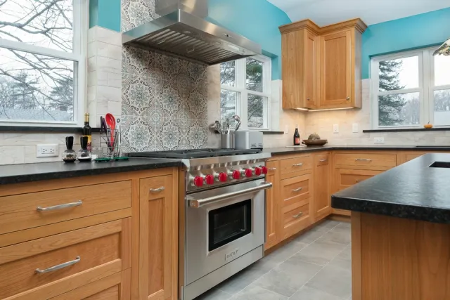 Modern kitchen with wood cabinets and stainless steel range