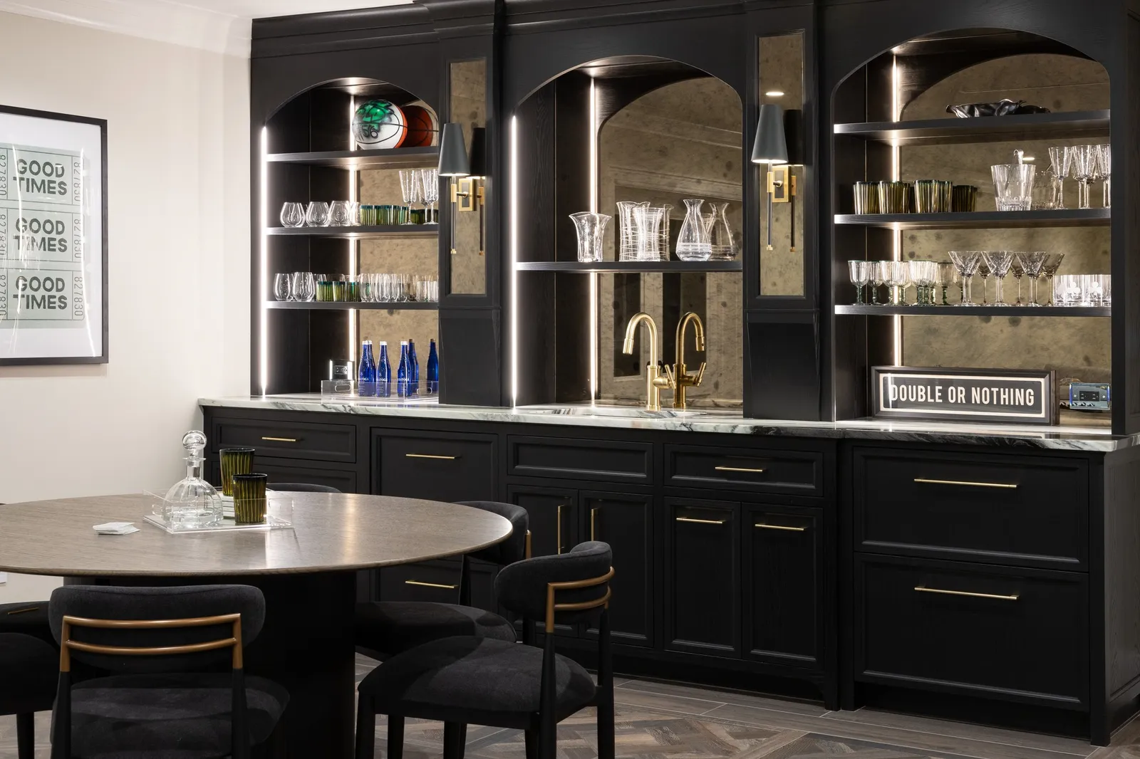 Dark, architectural, and rich in detail. The custom millwork in this entertaining space combines deep black cabinetry with illuminated arched shelving and antiqued mirror panels, creating a bar that feels equal parts classic and striking.
Cabinetry: Fallon Fine Cabinetry
Interior Designer: @tastedesigninc 
Photographer: @emilyobrienphoto_design 
Architect: @slocumhalldesign 
#CustomBar #HomeBarDesign #CustomCabinetry #CustomMillwork #LuxuryMillwork #LuxuryInteriors #LuxuryHomes #EntertainingSpace #BarDesign #BuiltInBar #ArchitecturalMillwork #CabinetryDesign #InteriorDetails #BespokeInteriors #LuxuryHomeDesign #FineWoodworking #MoodyInteriors #CustomBuilder #MassachusettsBuilder #NewEnglandHomes
