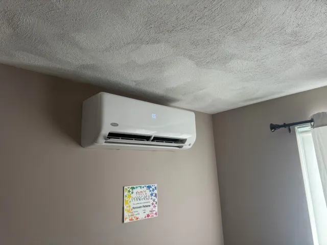 Ductless mini split head mounted on a wall