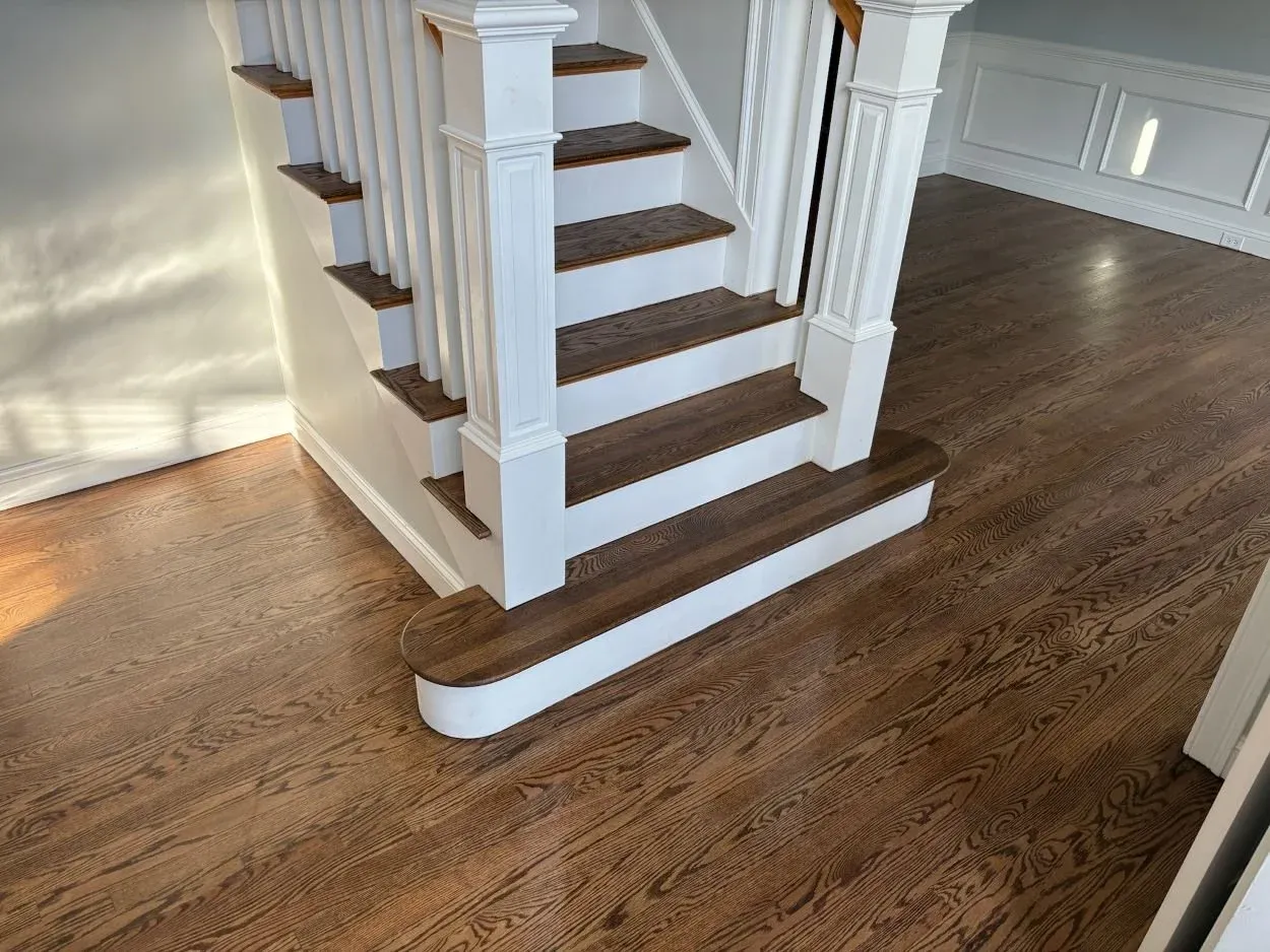 Dark walnut hardwood floor installation Central Mass entry way and family room.