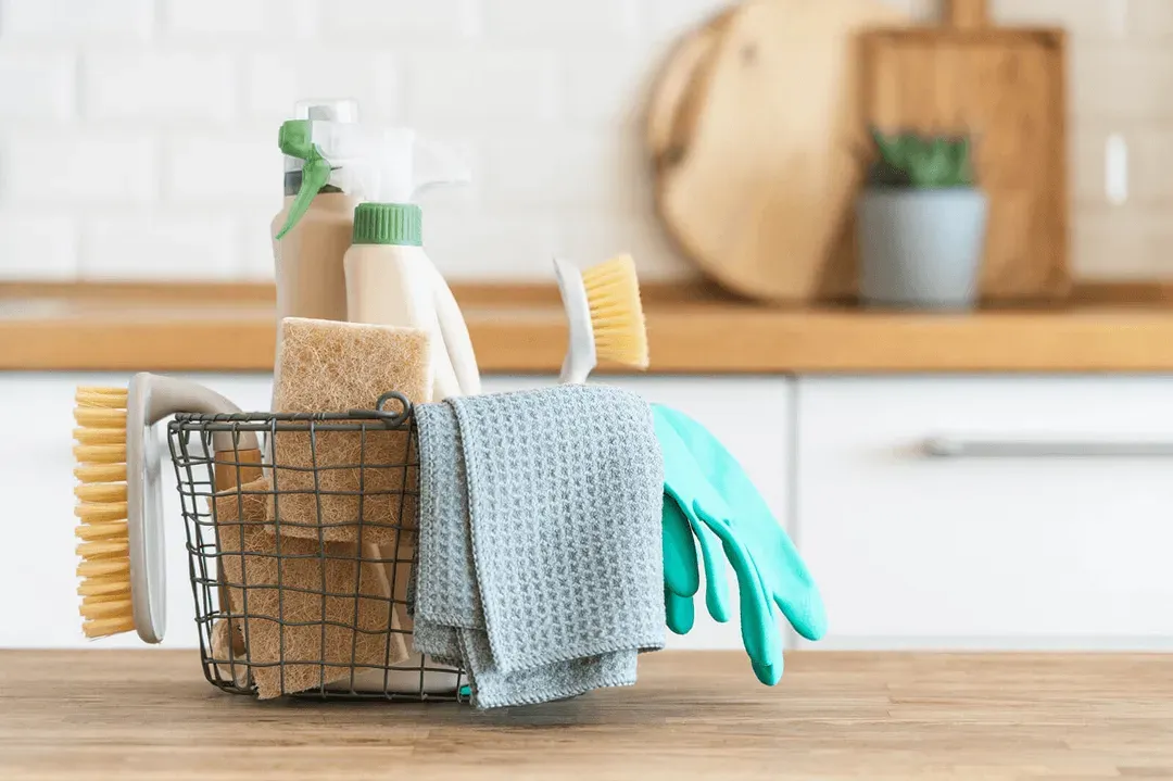 A basket of cleaning supplies