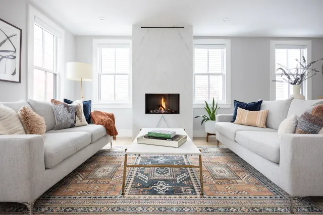 Living room with plaster fireplace surround