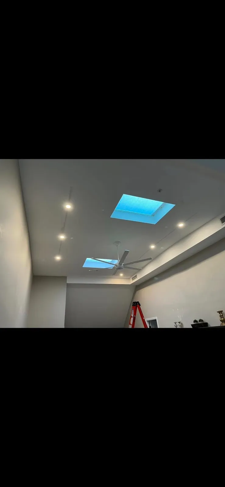 Recessed lighting and skylight in a finished room