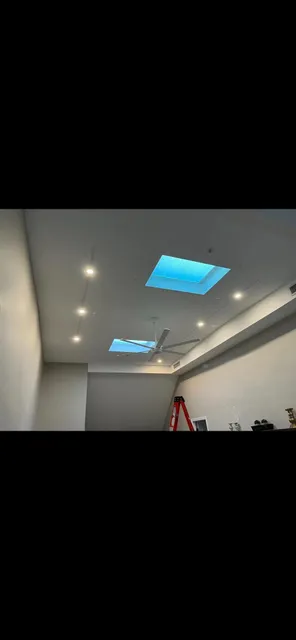 Recessed lighting and skylight in a finished room