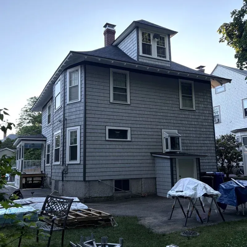 Completed roofing project on a multi-story New England home