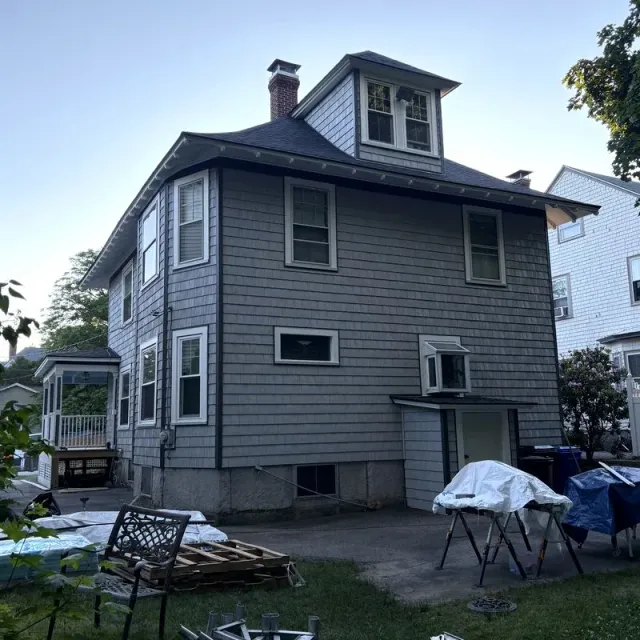 Completed roofing project on a multi-story New England home