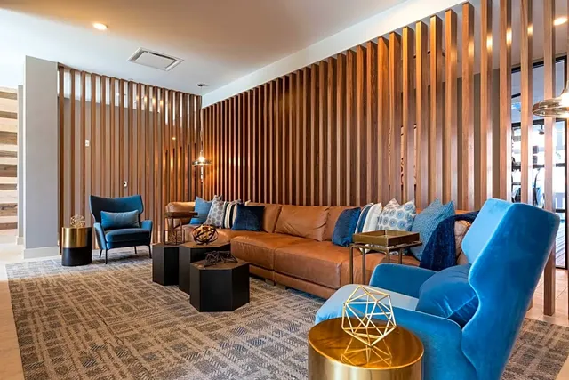 Commercial lounge with a floor-to-ceiling wood-slat partition — Hartford, CT