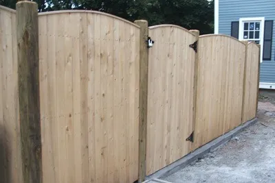 Cedar privacy fence with arched section and gate