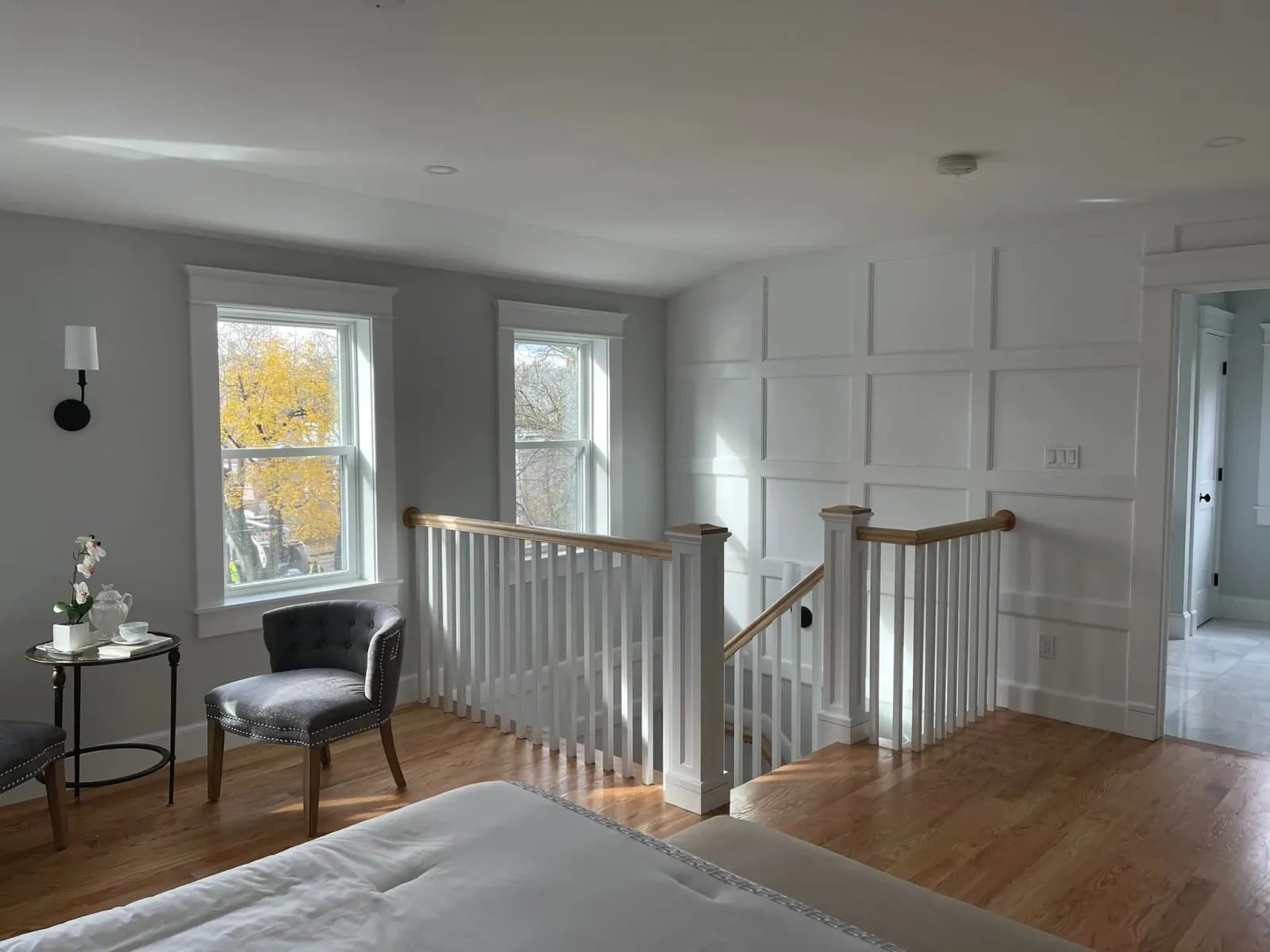 Upstairs landing with fitted wall panels around the stair opening