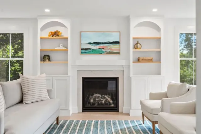 Painted living room with built-ins and fireplace