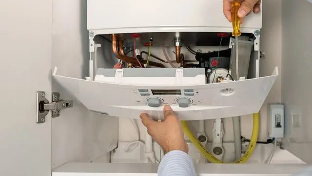 Technician repairing water filtration system