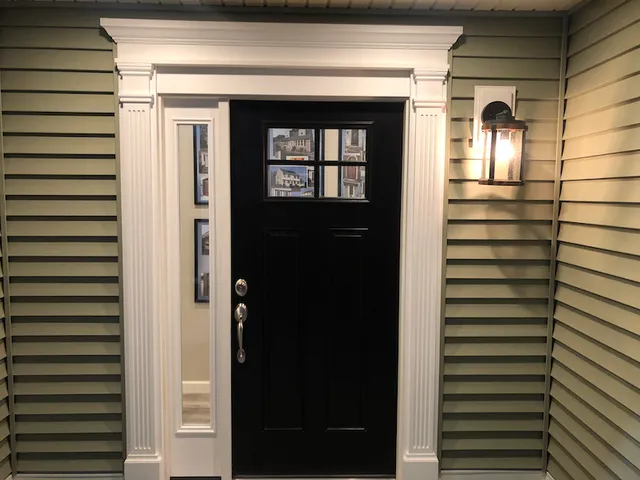 Hi-Tech Methuen showroom: entry door and lap siding display