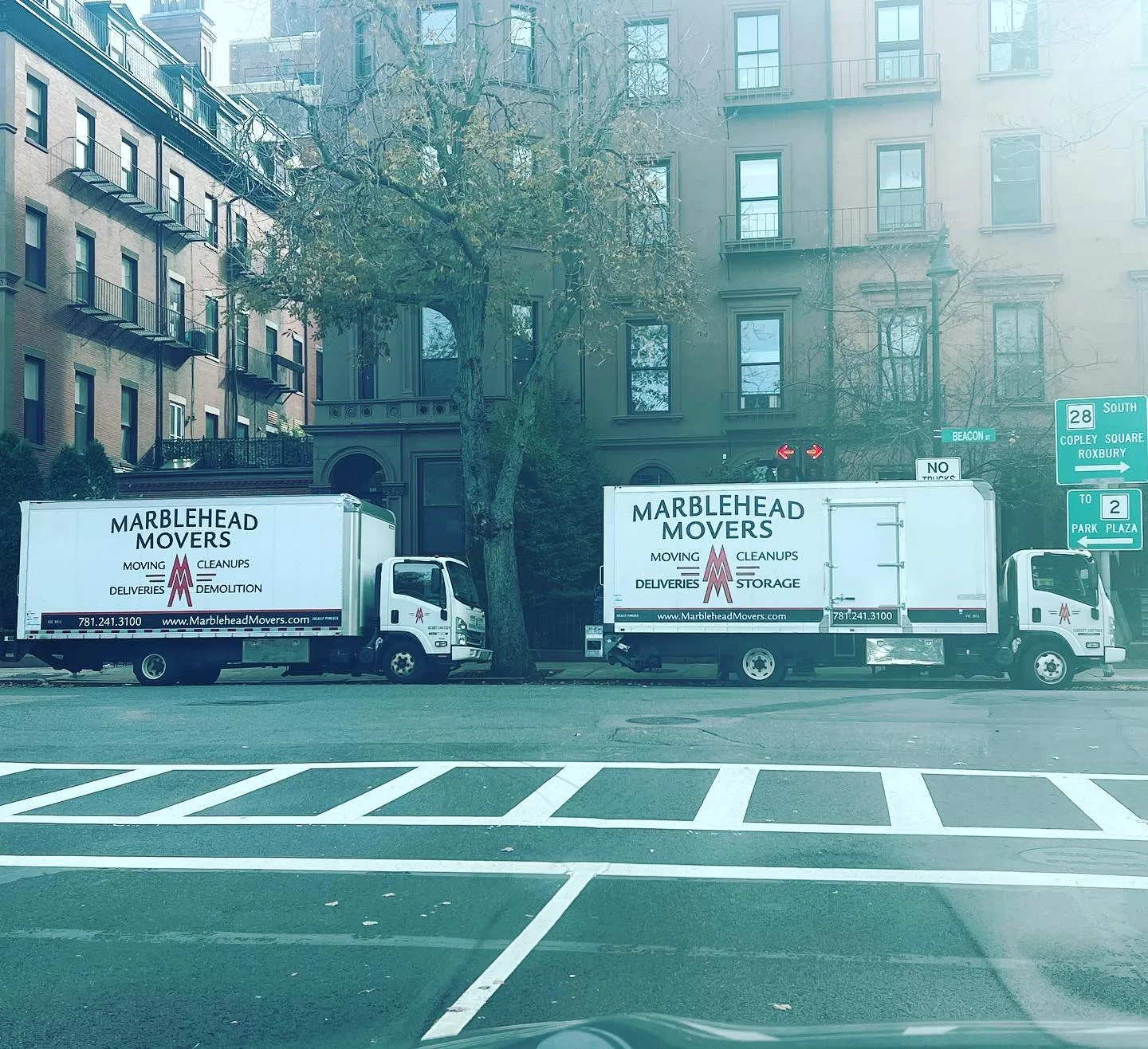 Two trucks on Beacon Street, Boston