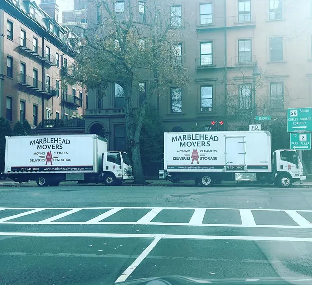 Two trucks on Beacon Street, Boston