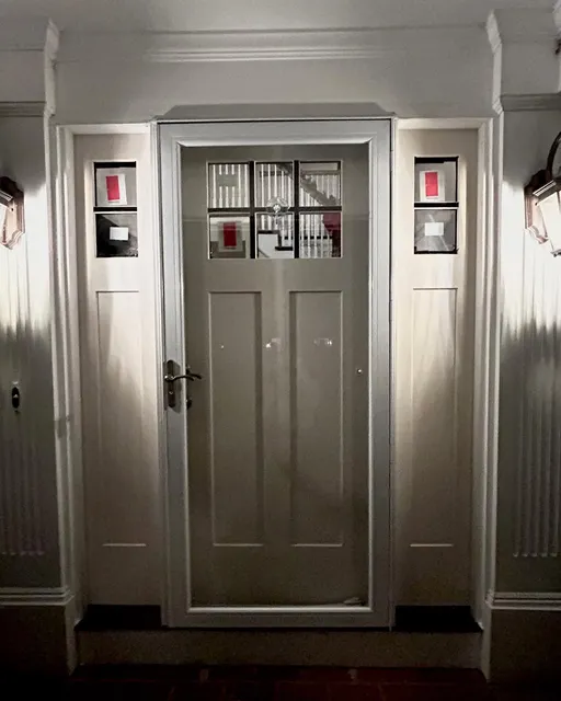 Craftsman entry door and sidelights in a renovated foyer