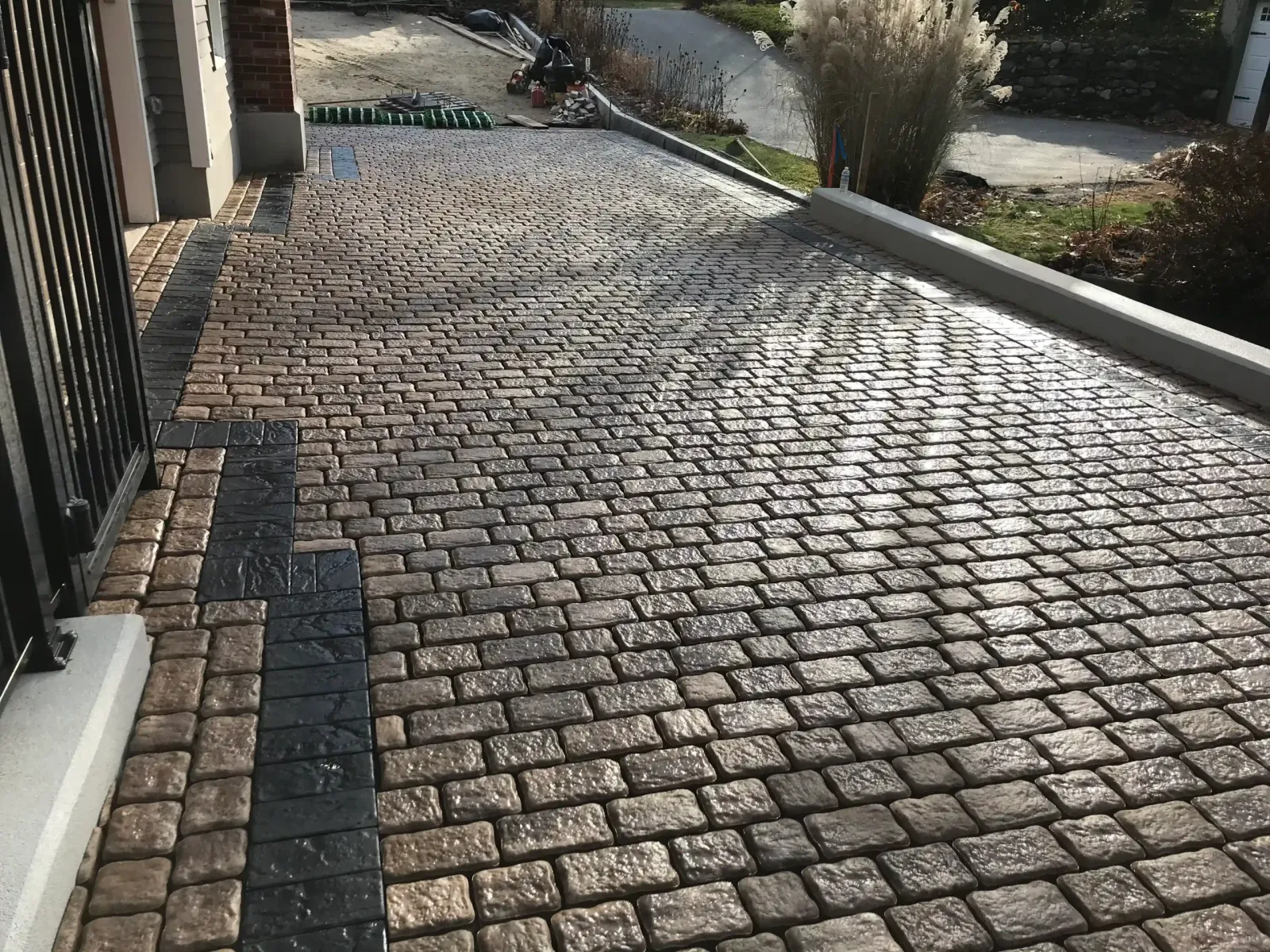 Stone-paved residential driveway and walkway