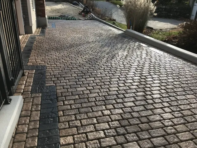 Stone-paved residential driveway and walkway