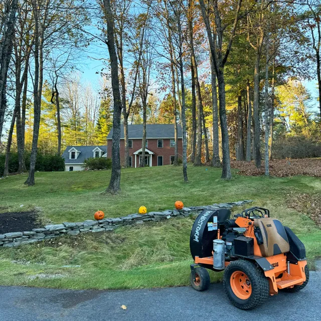 Picture of a large commercial leaf blower doing leaf and fall cleanup service near me