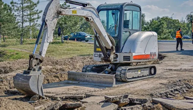 Mini excavator at construction site