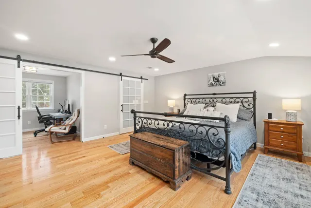 Master suite conversion in Southern New Hampshire — sleeping area with recessed lighting