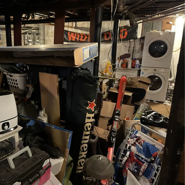 Junk in the driveway of a house