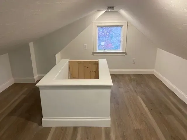 Light wood walls with white trim