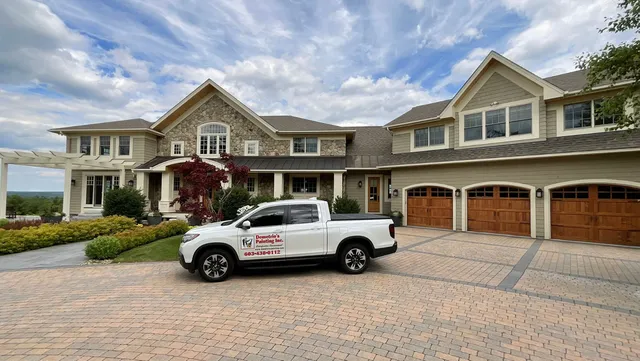 Demetrio's Painting truck at a finished luxury home