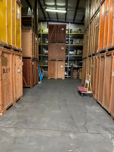 Rows of wooden storage vaults stacked inside the Murray's Moving & Storage warehouse