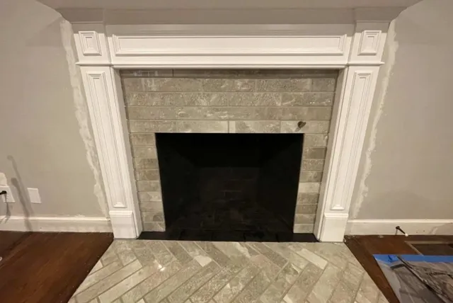 stone fireplace with white trim