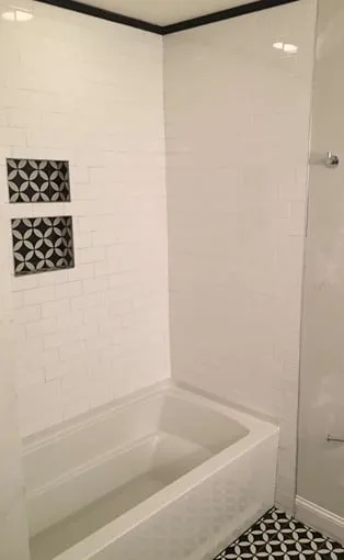 White tile bathtub shower surround