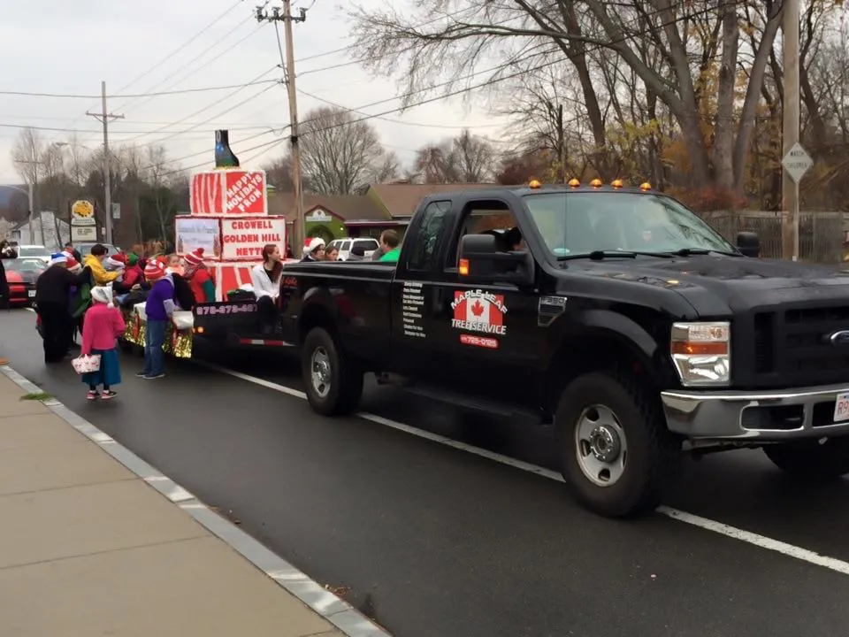 Maple Leaf Tree Service parade float and truck, family-owned tree service in Hampstead, NH.