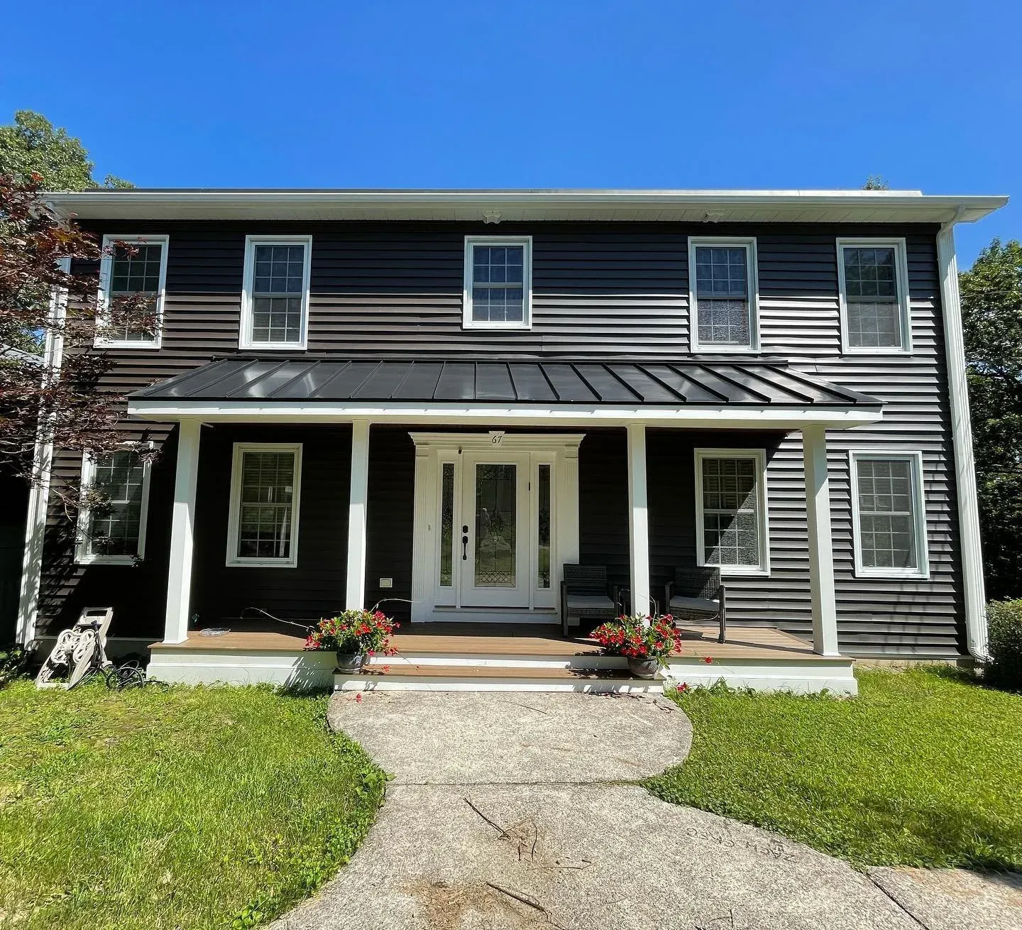 Another lovely exterior update done! From the new vinyl siding to the standing seam metal roof, this newly transformed Home is ready to boast its Beauty! For all your renovation needs contact us 📞📧 
&bull;
&bull;
&bull;
&bull;
#HBCONSTRUCTION #newc