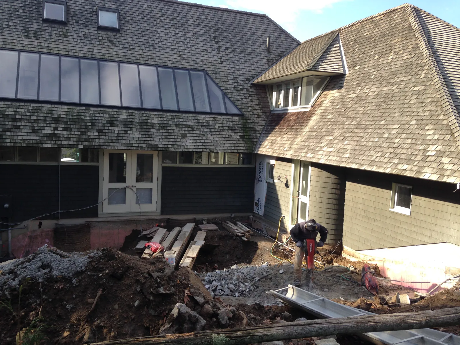 Foundation and addition work at a shingle-style home
