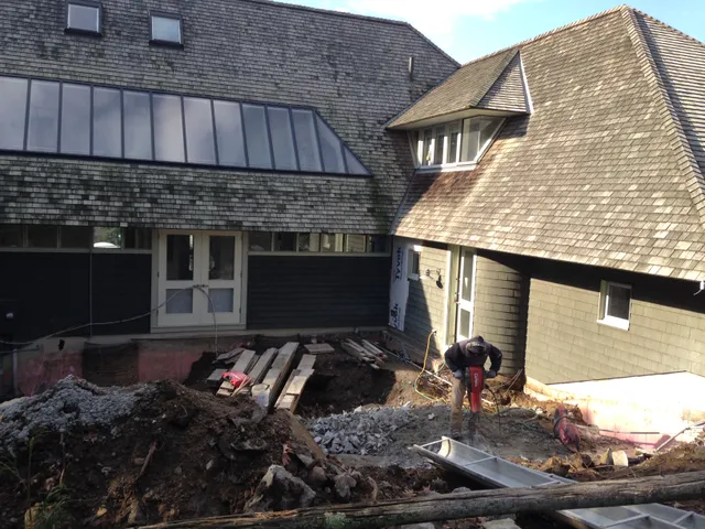 Foundation and addition work at a shingle-style home