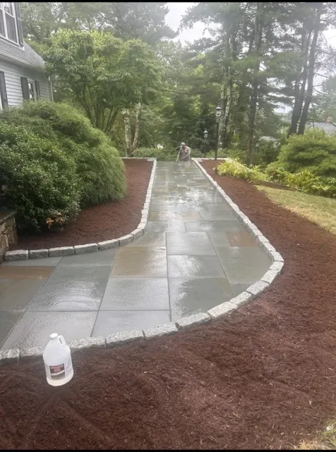 stone walkway and mulch bed hardscape landscaping