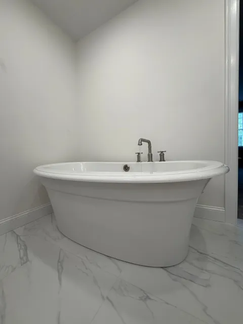 Bathroom remodel with freestanding soaking tub by Smith Solutions Plumbing, Worcester County MA.jpeg