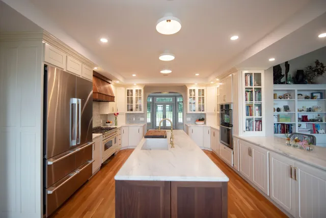 The Kitchen remodel features a large island and high end stove