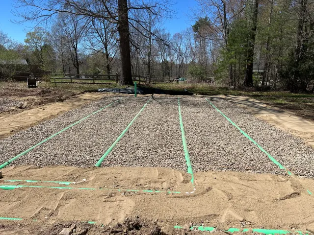 Stone leach field trenches for a full septic system replacement, Belchertown MA