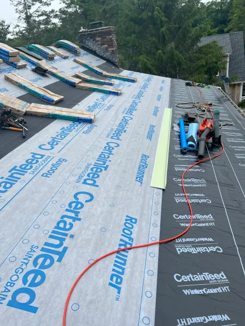 Roof installation in Cape Cod, MA with CertainTeed underlayment and waterproof ice and water shield for durable weather protection.