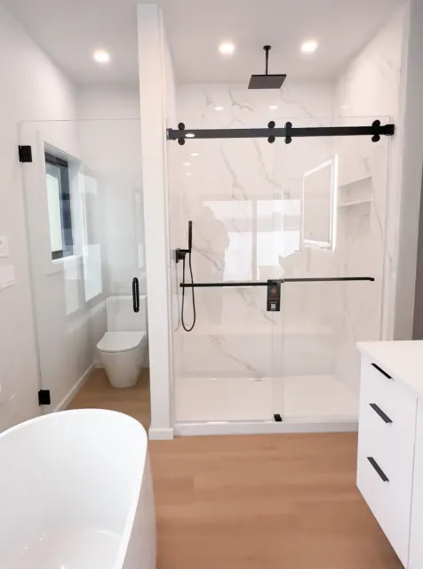 Sliding shower door with matte black hardware
