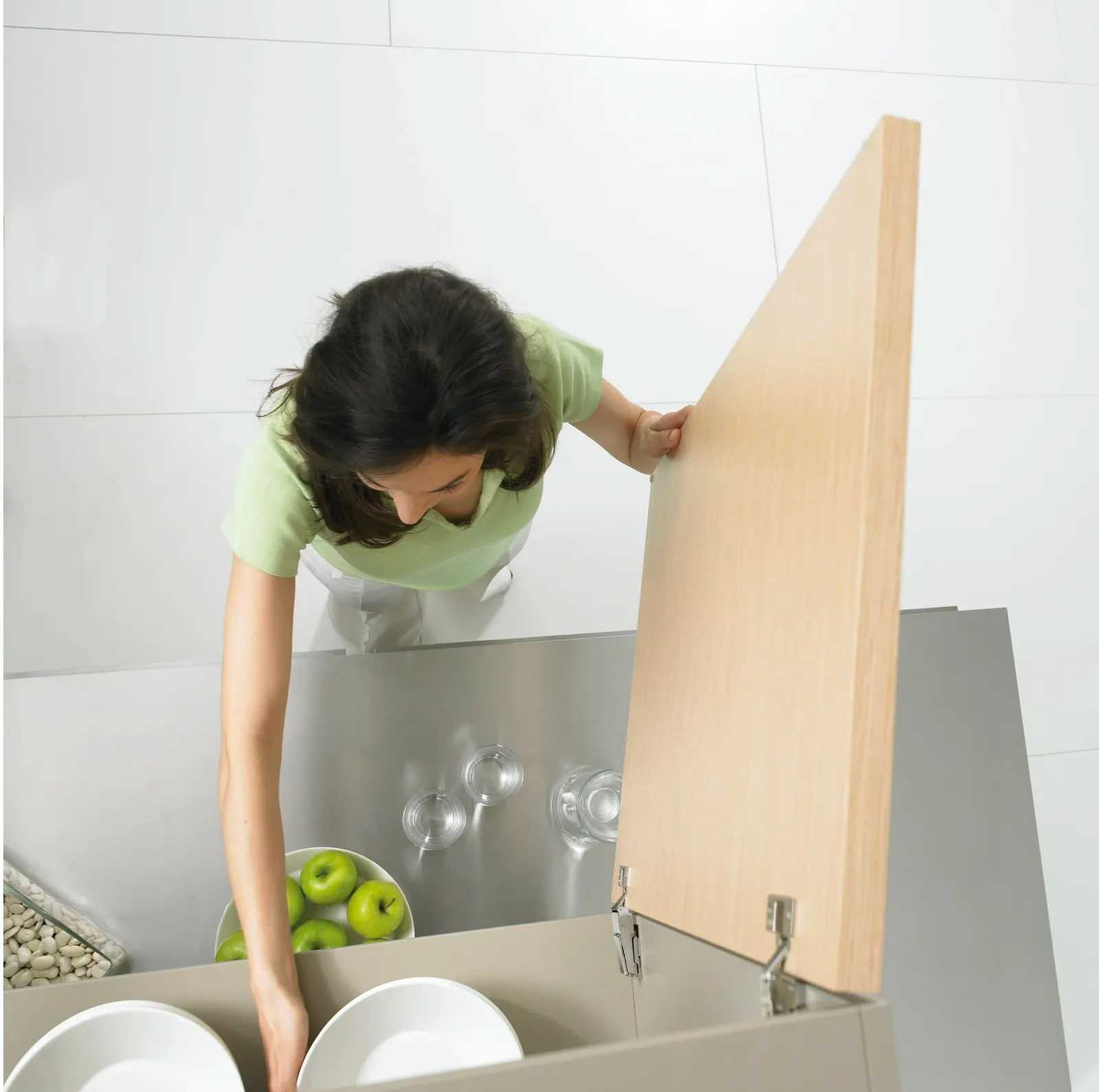Maid organizing kitchen